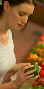 Woman choosing healthy food at the supermarket