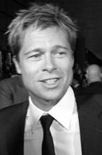 Brad Pitt wearing a suit and smiling